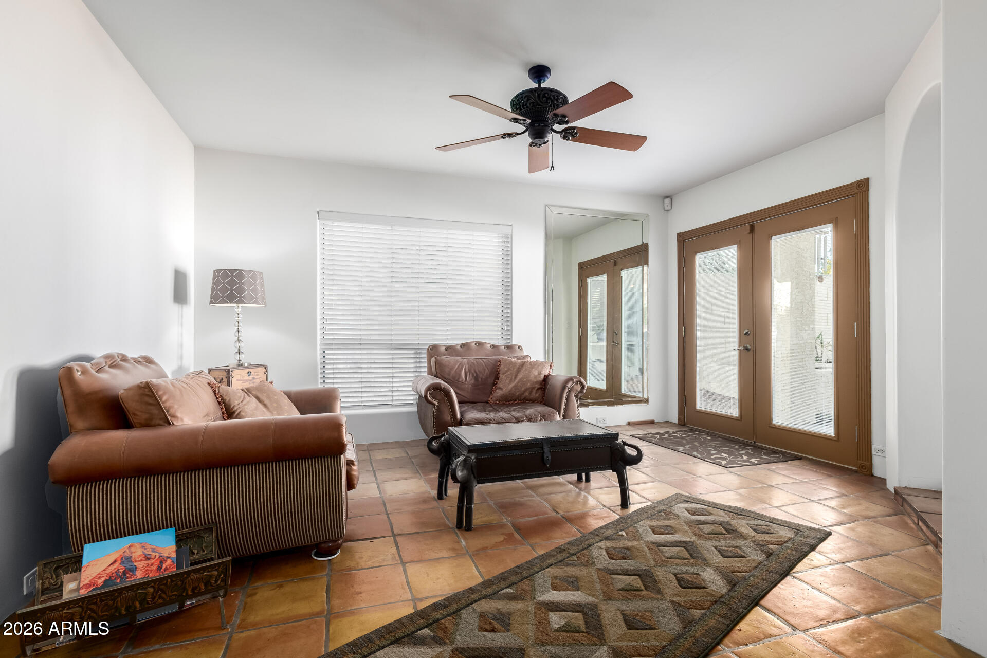 9012 South 47th Place Phoenix, AZ 85044 - Photo 11 of 54 a living room with furniture and a window