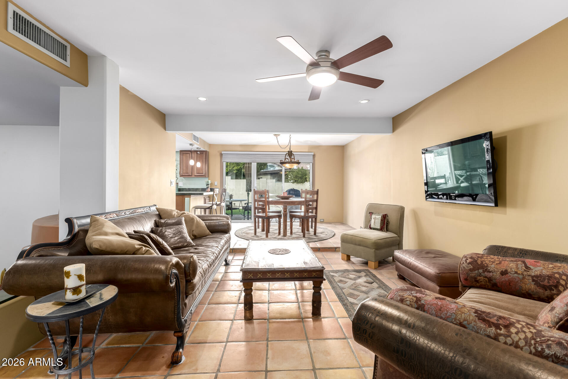 9012 South 47th Place Phoenix, AZ 85044 - Photo 14 of 54 a living room with furniture and a flat screen tv