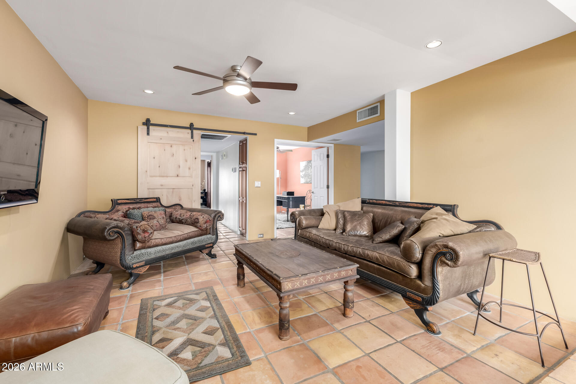 9012 South 47th Place Phoenix, AZ 85044 - Photo 15 of 54 a living room with furniture and a flat screen tv