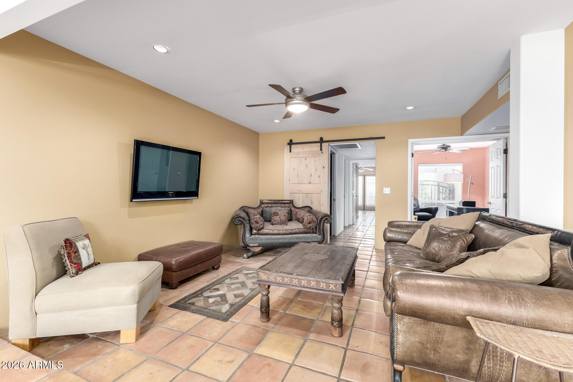 9012 South 47th Place Phoenix, AZ 85044 - Photo 16 of 54 a living room with furniture and a flat screen tv
