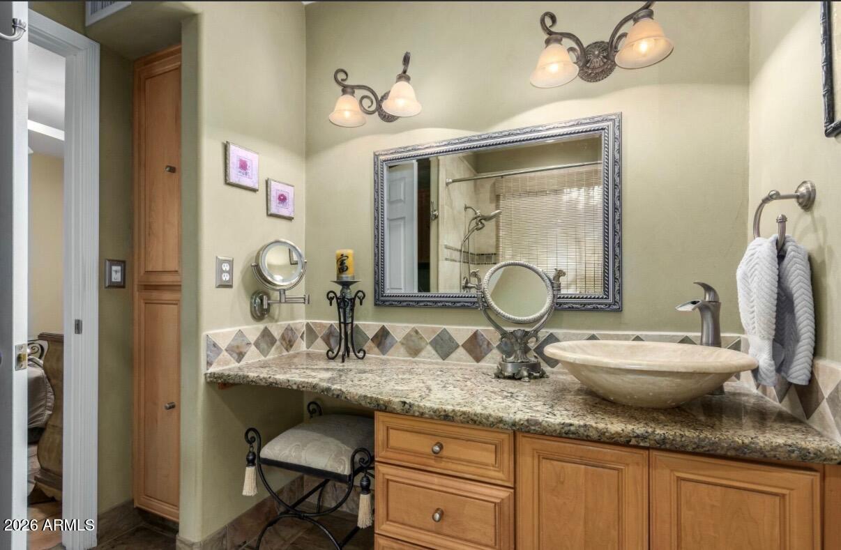 9012 South 47th Place Phoenix, AZ 85044 - Photo 30 of 54 a bathroom with a granite countertop double vanity and a mirror