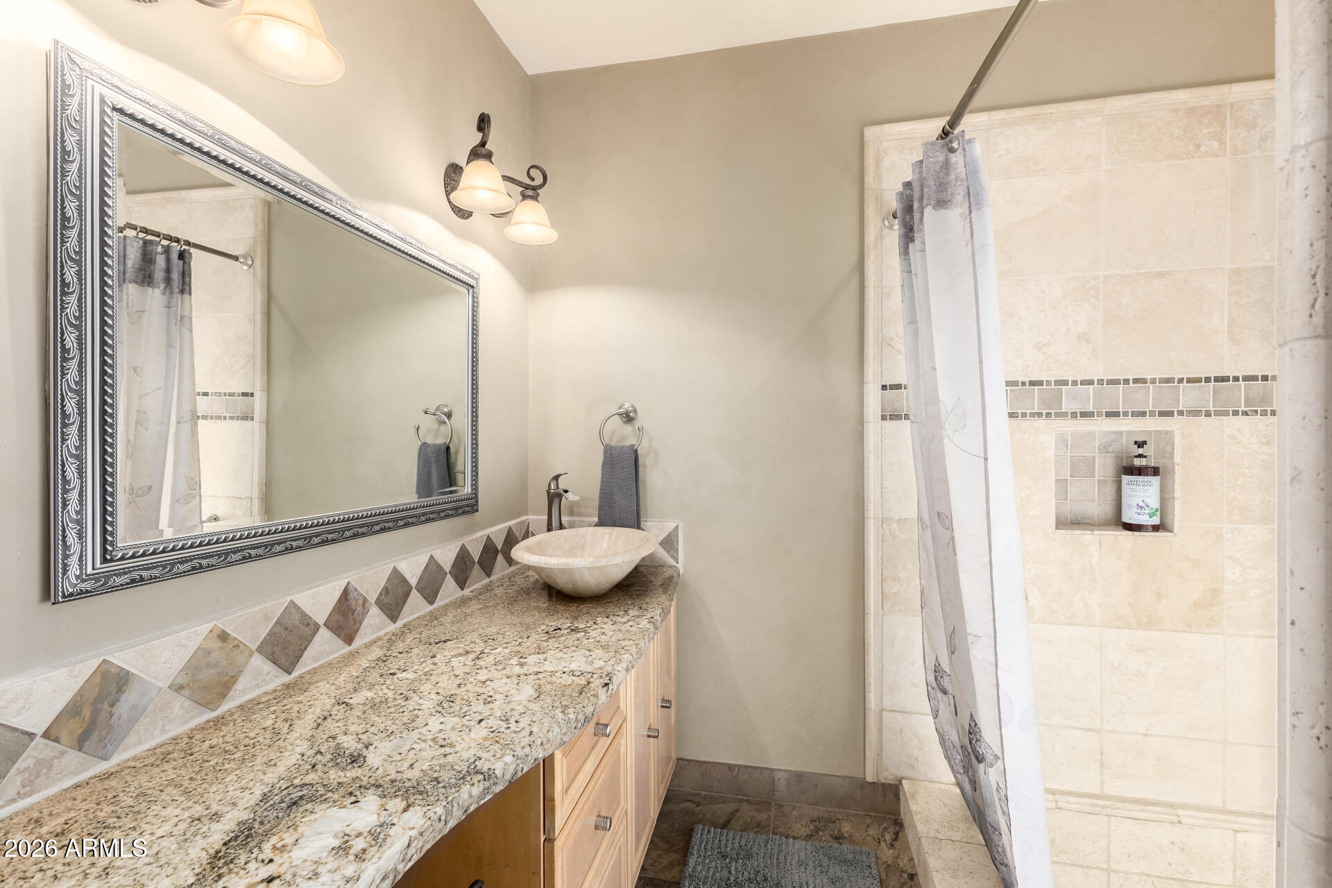9012 South 47th Place Phoenix, AZ 85044 - Photo 32 of 54 a bathroom with a granite countertop sink a mirror and shower