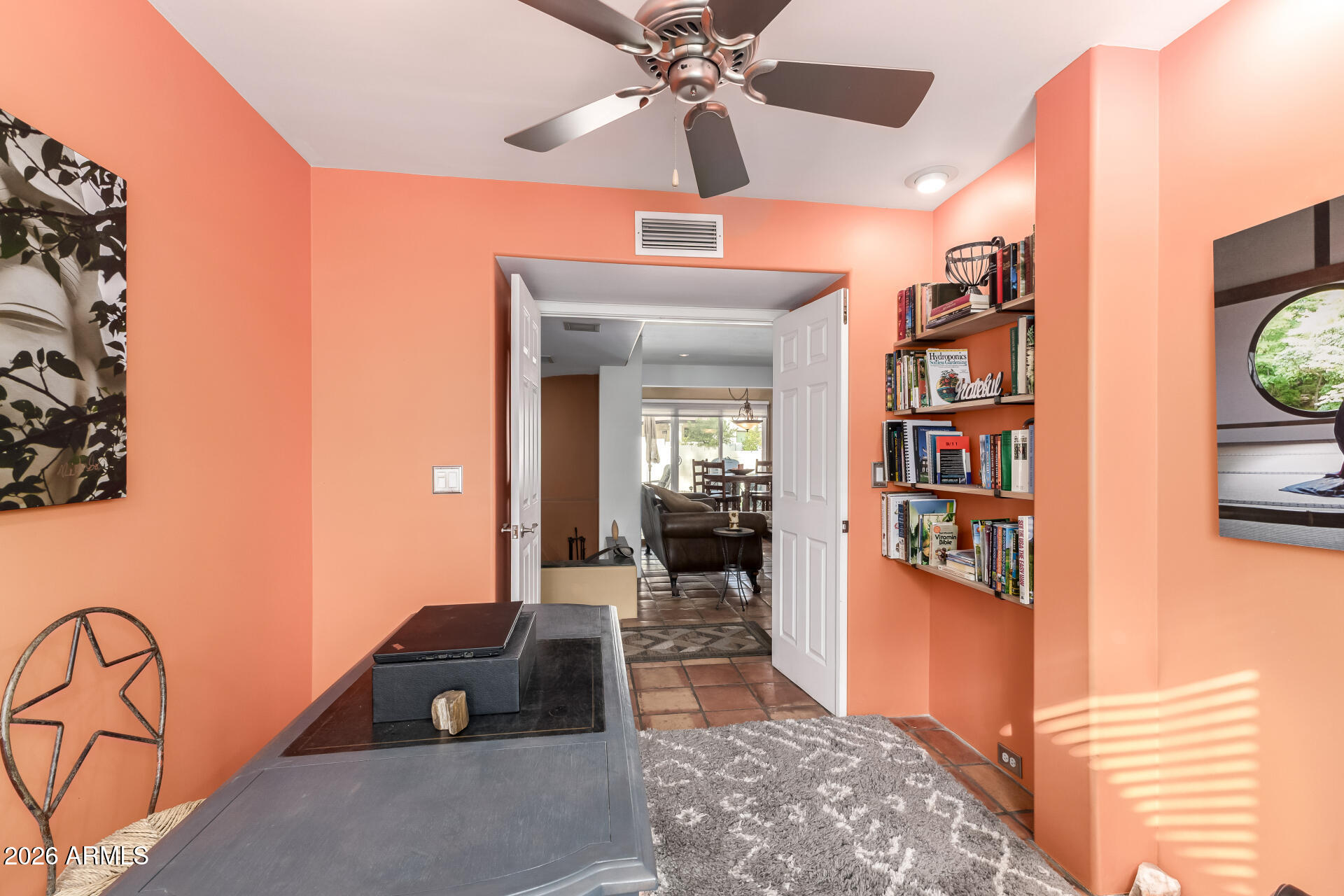 9012 South 47th Place Phoenix, AZ 85044 - Photo 38 of 54 a living room with furniture and a chandelier