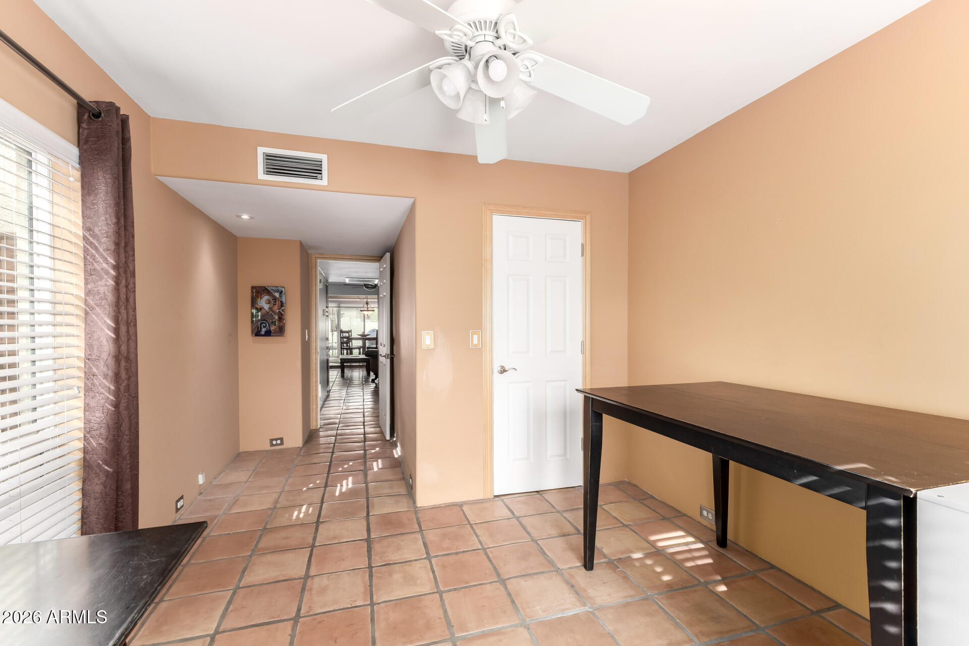 9012 South 47th Place Phoenix, AZ 85044 - Photo 42 of 54 a view of a hallway with a chandelier and a dining table