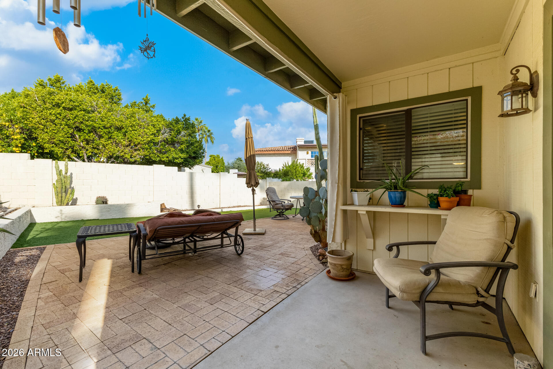 9012 South 47th Place Phoenix, AZ 85044 - Photo 45 of 54 a building outdoor space with patio furniture and potted plants