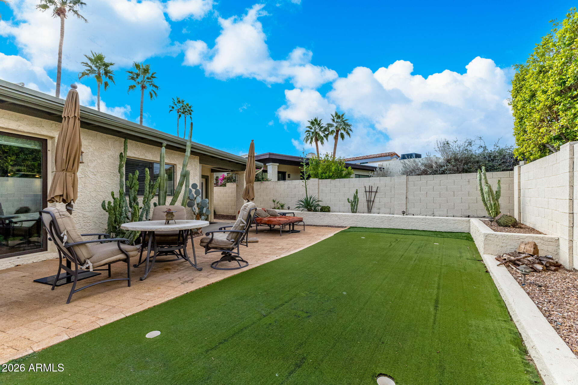 9012 South 47th Place Phoenix, AZ 85044 - Photo 49 of 54 a view of a house with backyard and sitting area