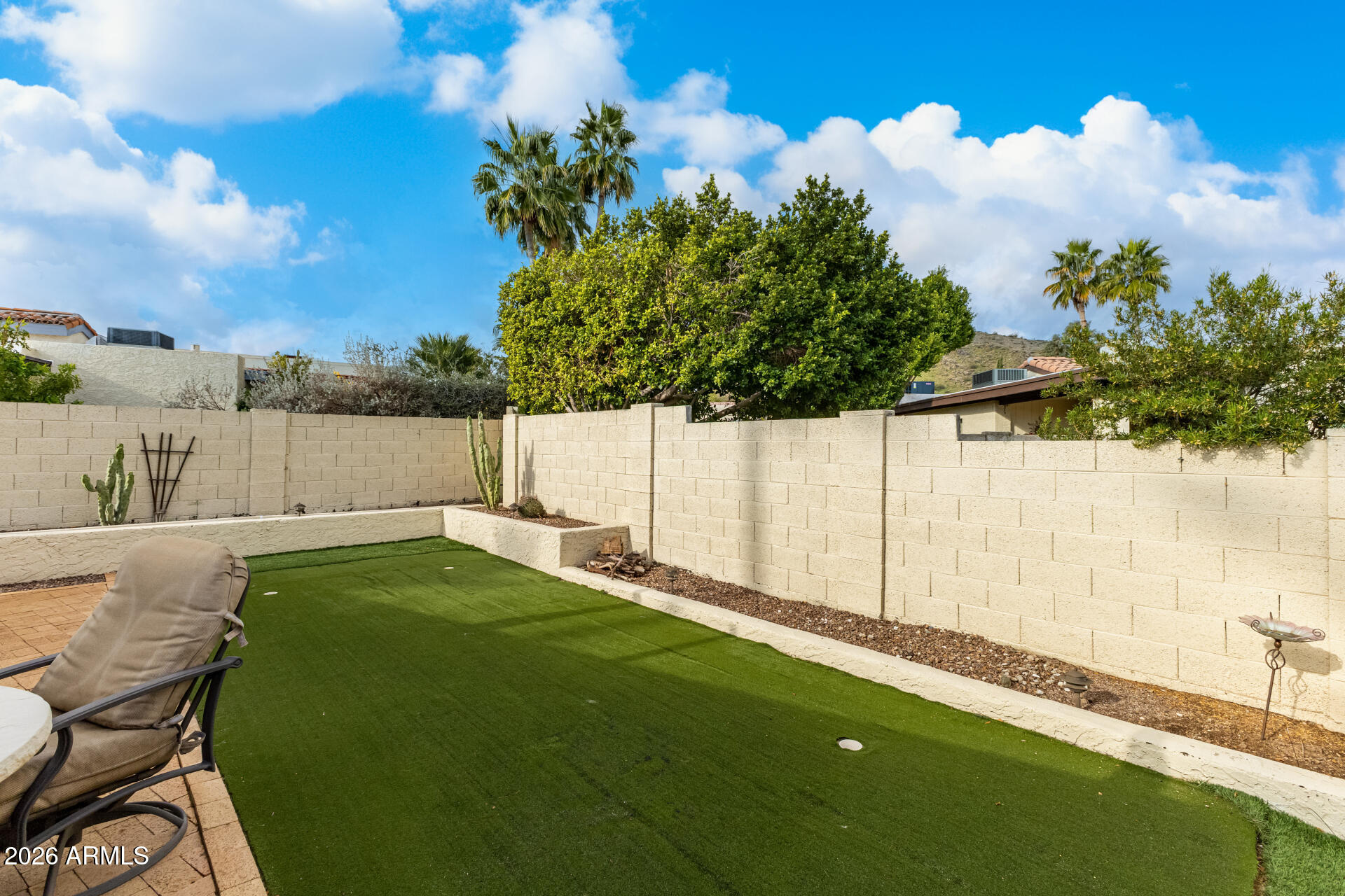 9012 South 47th Place Phoenix, AZ 85044 - Photo 50 of 54 a backyard of a house with table and chairs