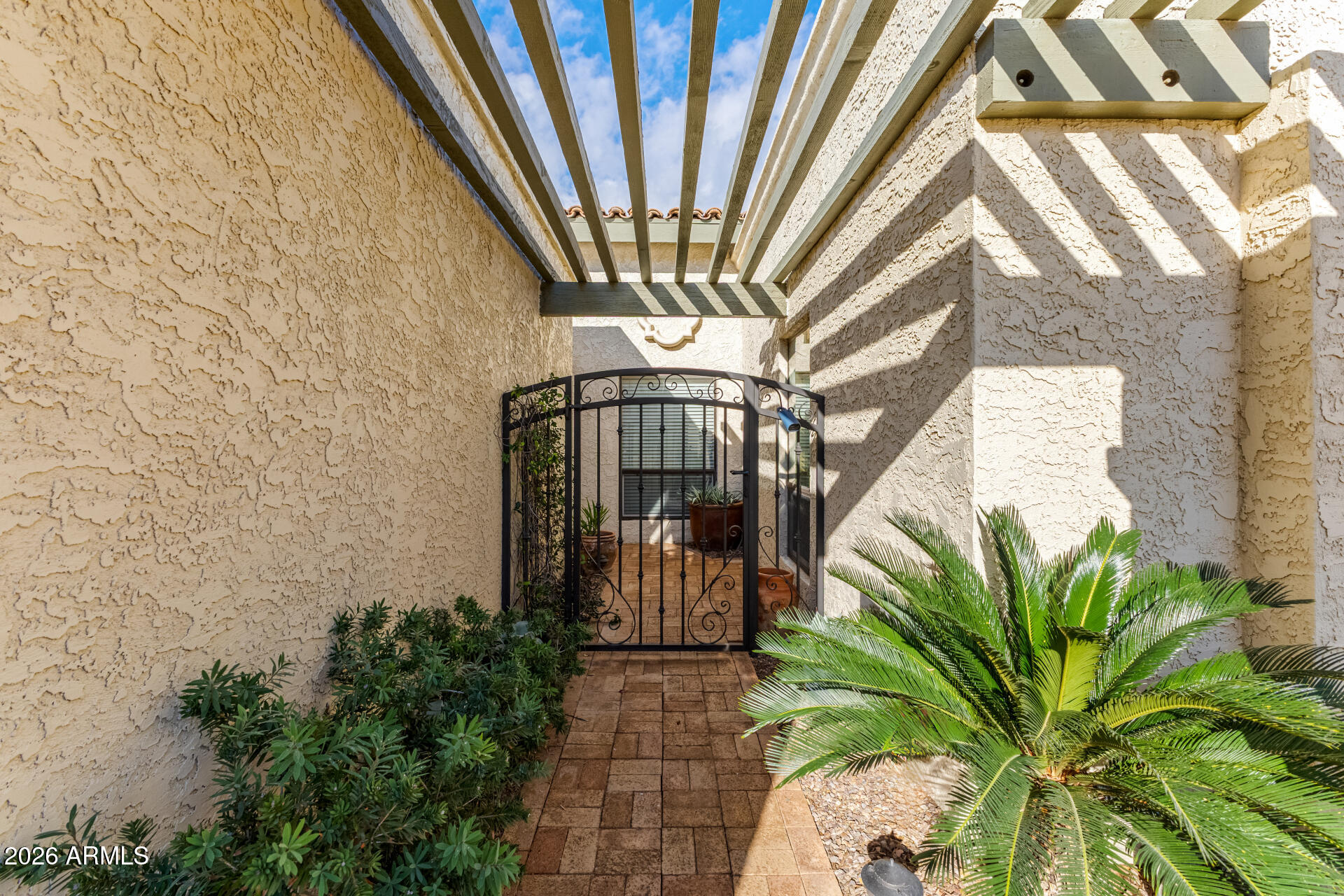 9012 South 47th Place Phoenix, AZ 85044 - Photo 5 of 54 a vase of flowers sitting on a floor in front of a door