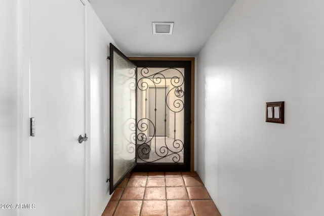 a view of a hallway with windows