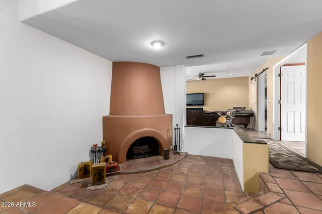 a view of a livingroom with furniture and a fireplace