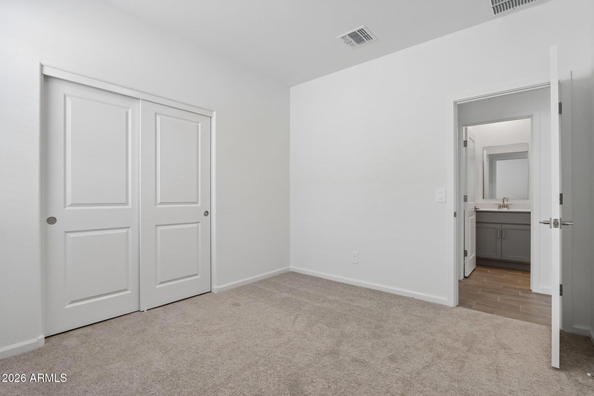 9544 West Gaby Road Tolleson, AZ 85353 - Photo 27 of 43 a view of a room with a wardrobe space