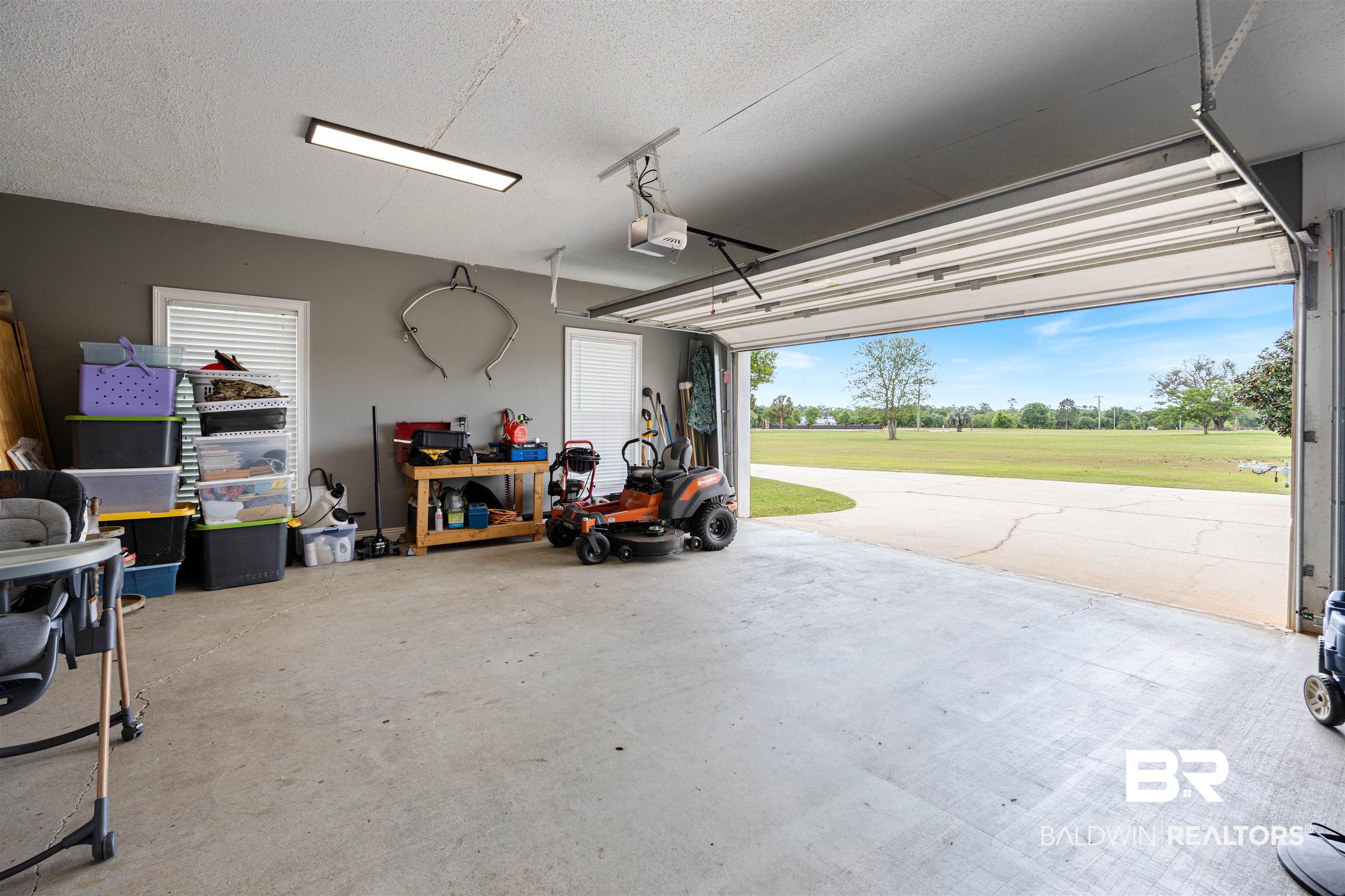 9855 Stucki Road Elberta, AL 36530 - Photo 51 of 54 Garage featuring golf course view and a garage door opener