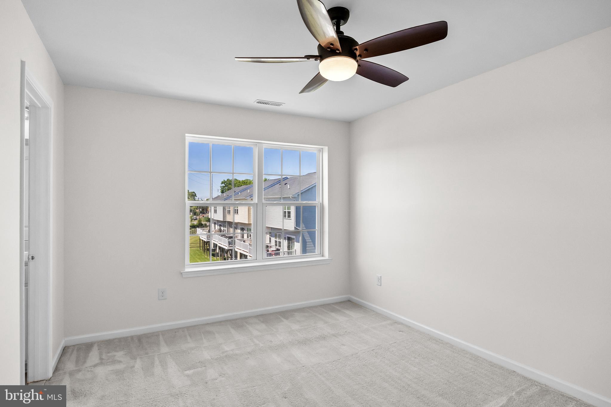 8 Iron Gate Road Sicklerville, NJ 08081 - Photo 21 of 33 an empty room with window and ceiling fan