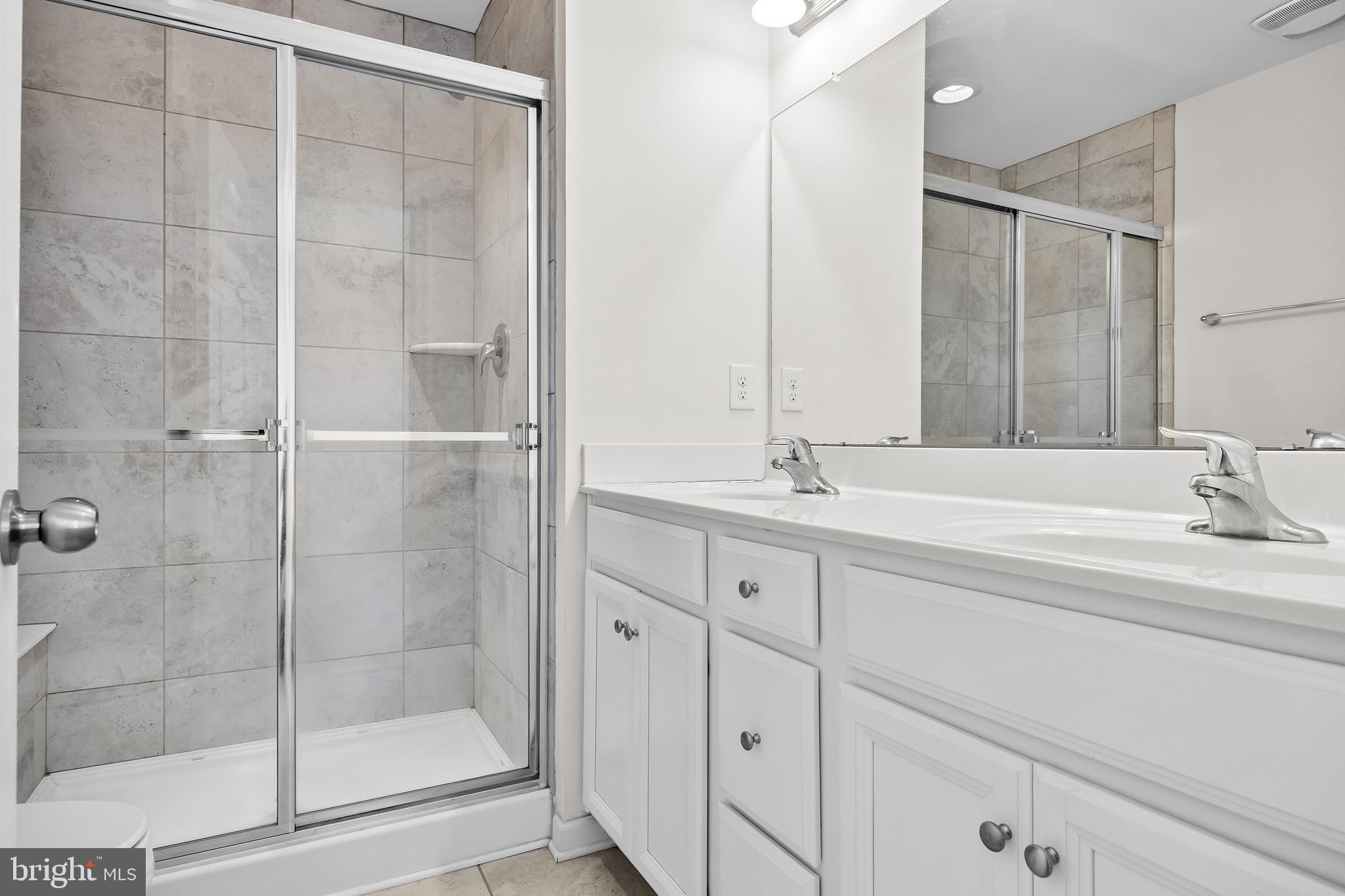 8 Iron Gate Road Sicklerville, NJ 08081 - Photo 23 of 33 a spacious bathroom with a shower and a sink