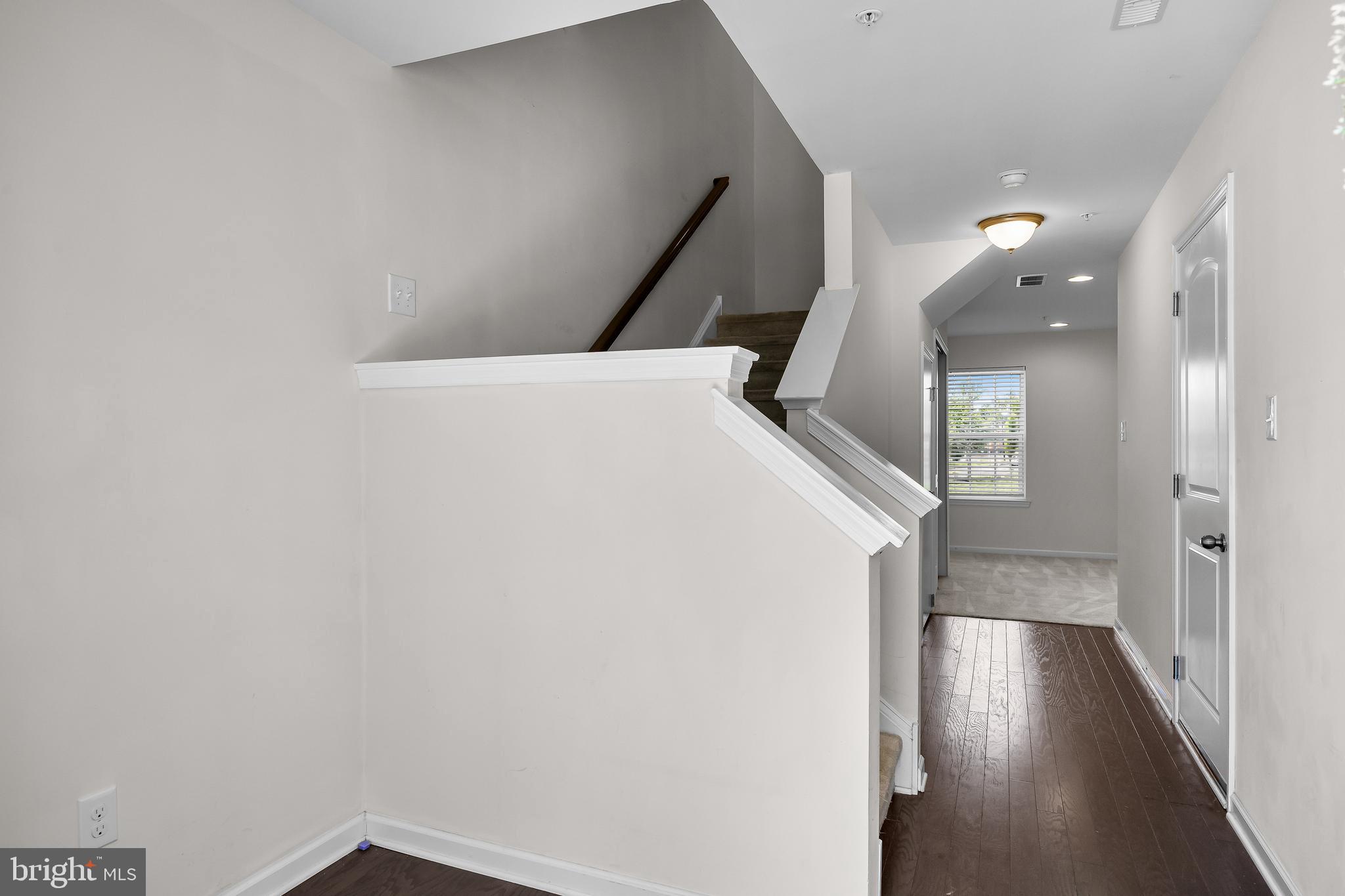 8 Iron Gate Road Sicklerville, NJ 08081 - Photo 5 of 33 a view of a hallway with wooden floor
