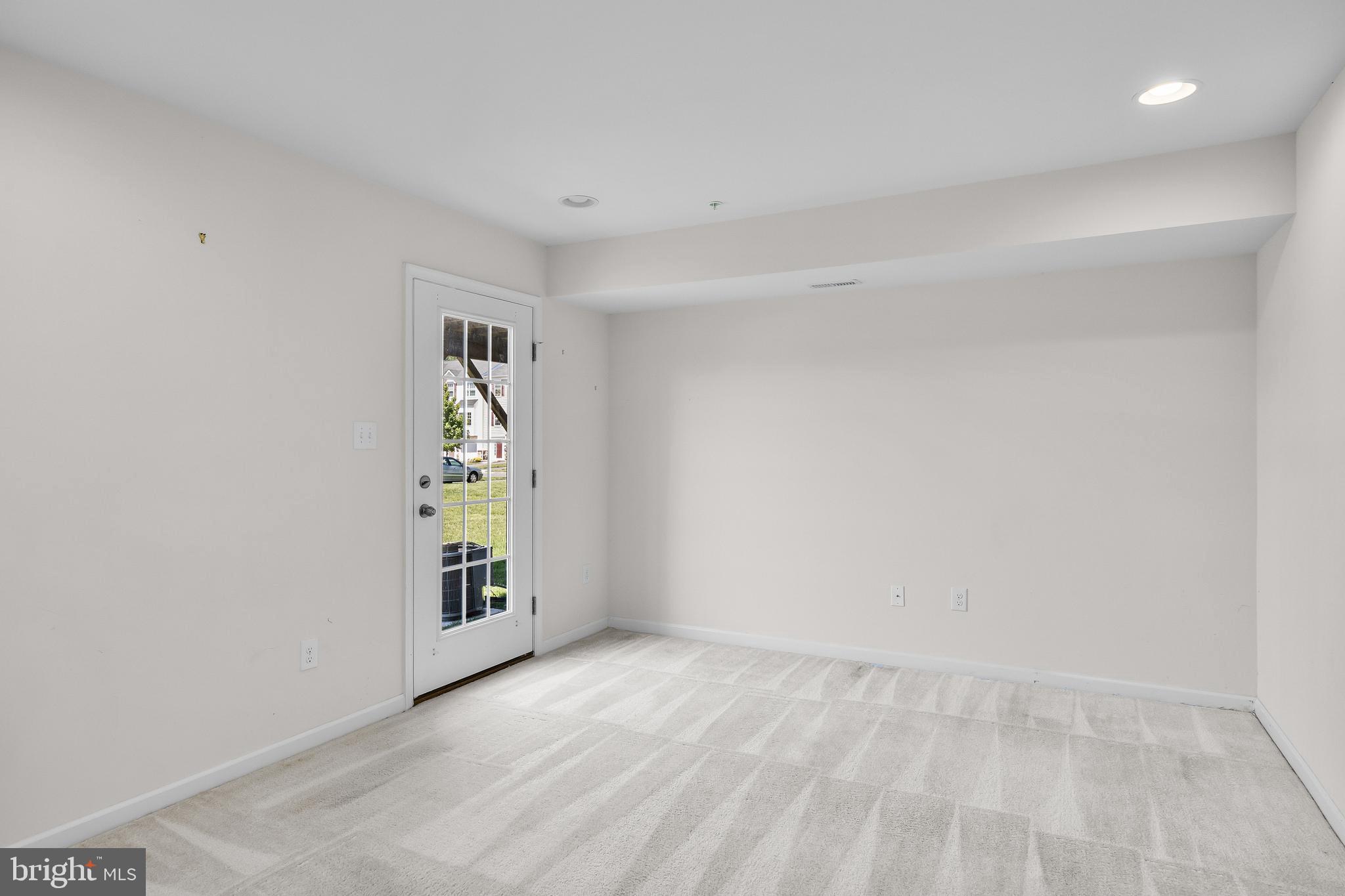 8 Iron Gate Road Sicklerville, NJ 08081 - Photo 6 of 33 a view of an empty room with a window and wooden floor