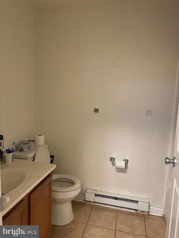a bathroom with a toilet and a sink