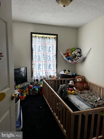 a kitchen with a sink appliances cabinets and a window