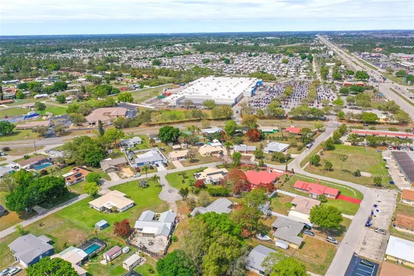 an aerial view of residential houses with outdoor space