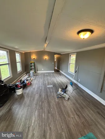 wooden floor with a window in a room