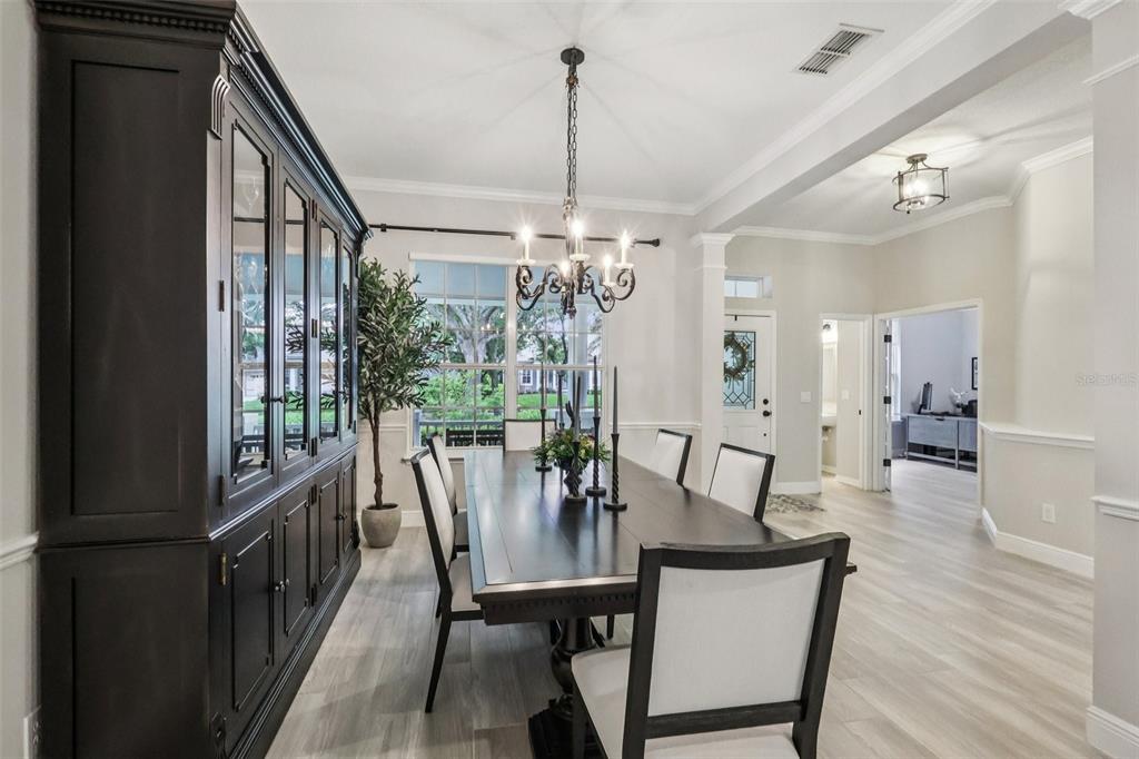 8350 Bowden Way Windermere, FL 34786 - Photo 11 of 45 a view of a dining room with furniture window and wooden floor