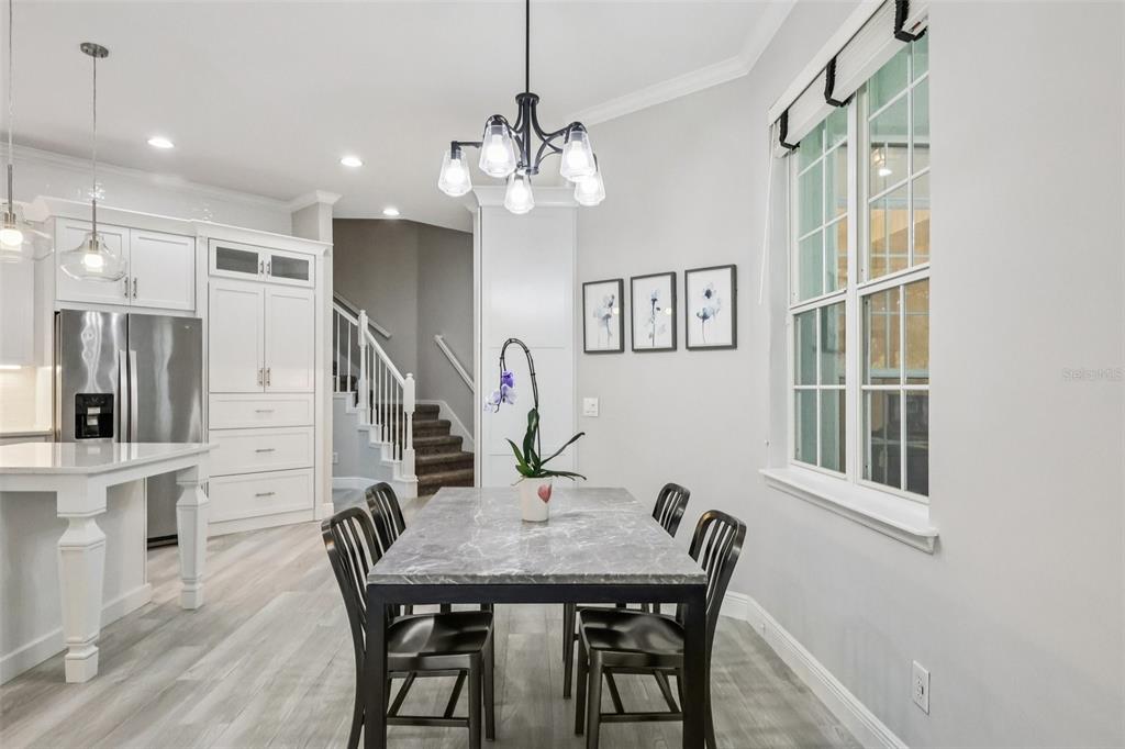 8350 Bowden Way Windermere, FL 34786 - Photo 15 of 45 a view of a dining room with furniture and a chandelier
