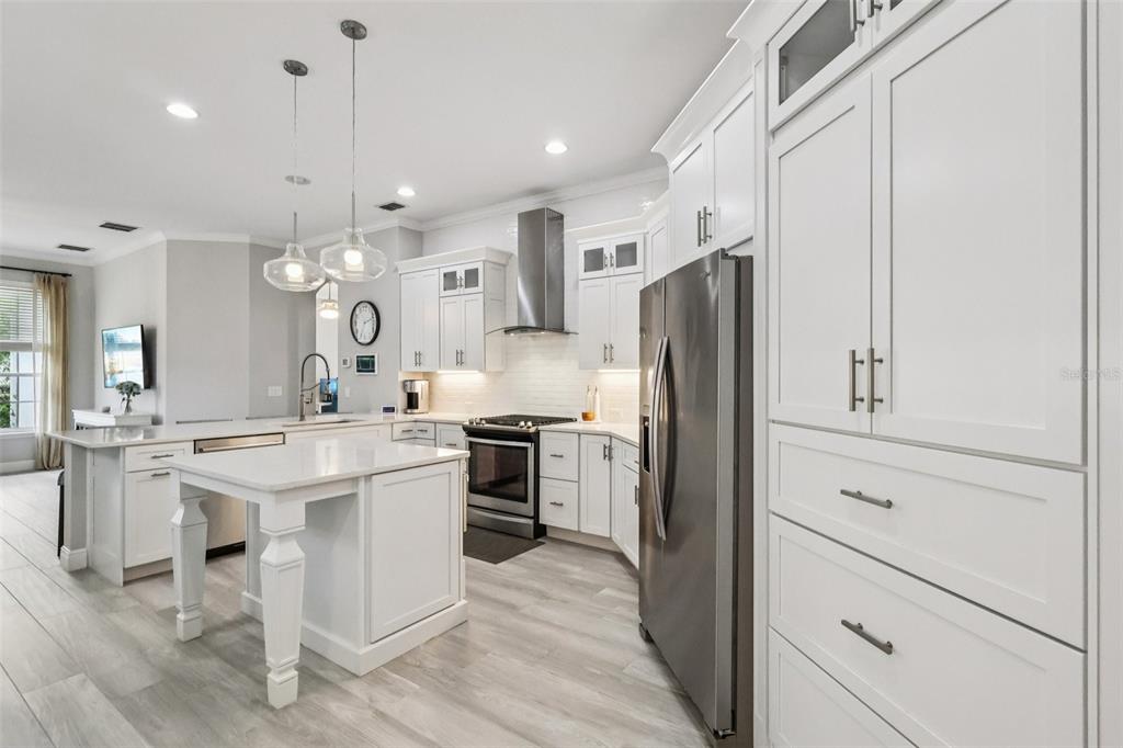 8350 Bowden Way Windermere, FL 34786 - Photo 19 of 45 a kitchen with a sink stainless steel appliances and cabinets