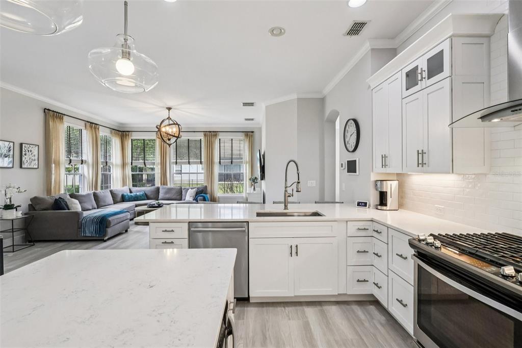 8350 Bowden Way Windermere, FL 34786 - Photo 20 of 45 a kitchen with stainless steel appliances granite countertop a stove and cabinets