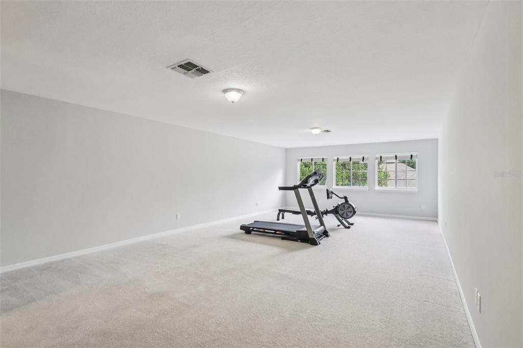 8350 Bowden Way Windermere, FL 34786 - Photo 36 of 45 a view of a room with gym equipment