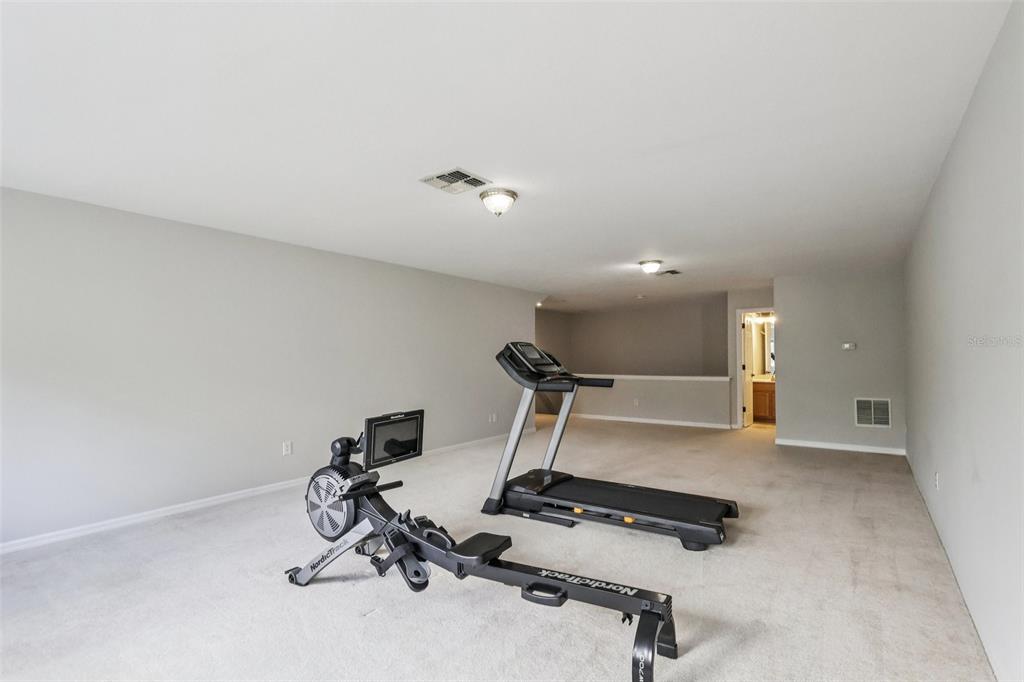 8350 Bowden Way Windermere, FL 34786 - Photo 37 of 45 a view of a room with gym equipment