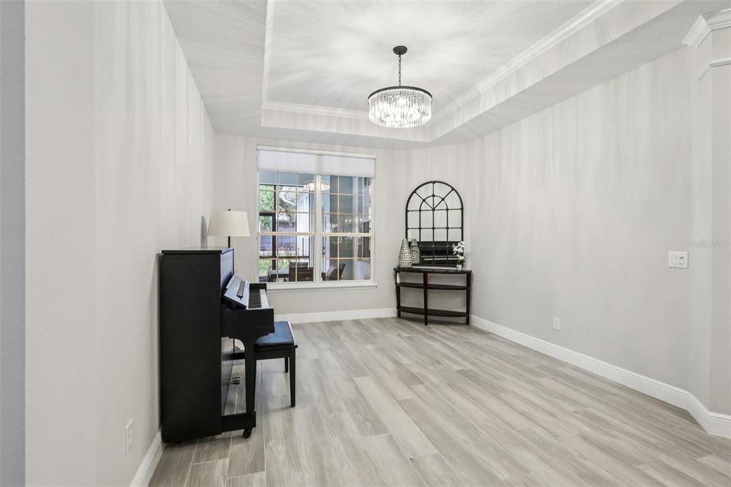 8350 Bowden Way Windermere, FL 34786 - Photo 8 of 45 a living room with furniture and a wooden floor