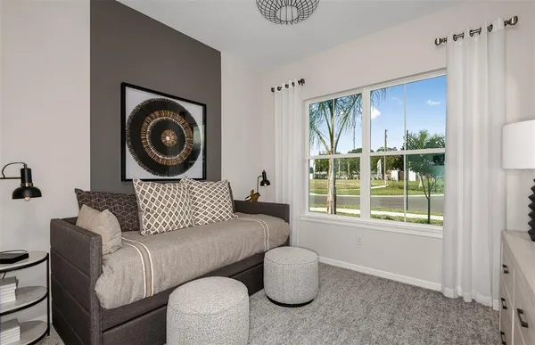 a living room with furniture and a window