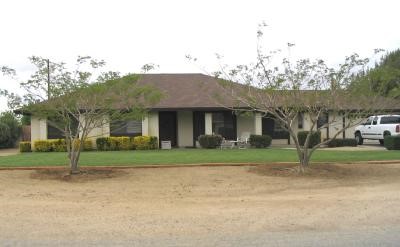 14062 Havasu Road Apple Valley, CA 92307 - Photo 1 of 1 a front view of a house with a yard