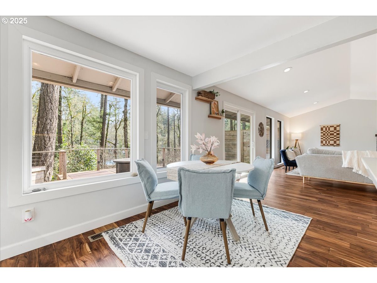 4268 Woodside Circle Lake Oswego, OR 97035 - Photo 11 of 44 a dining room with wooden floor and a rug