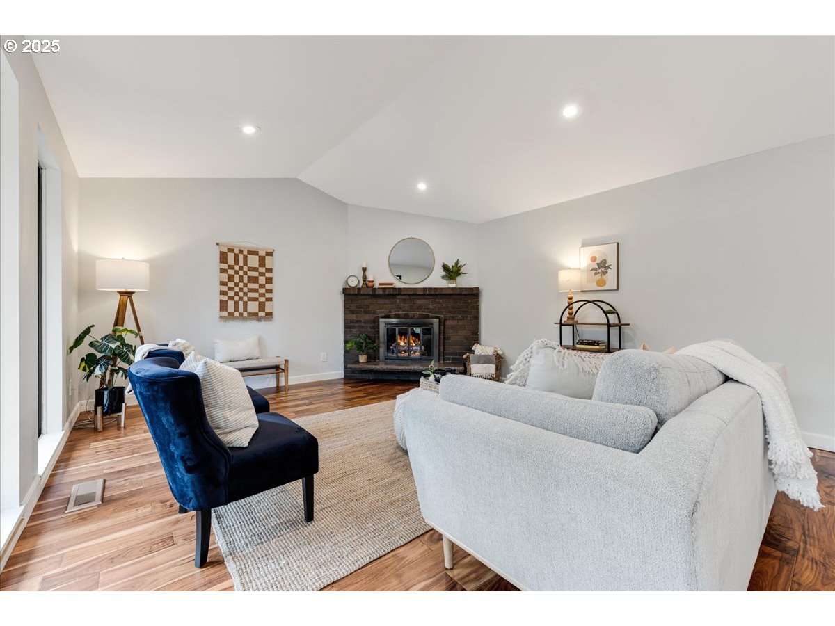 4268 Woodside Circle Lake Oswego, OR 97035 - Photo 13 of 44 a living room with furniture and a fireplace