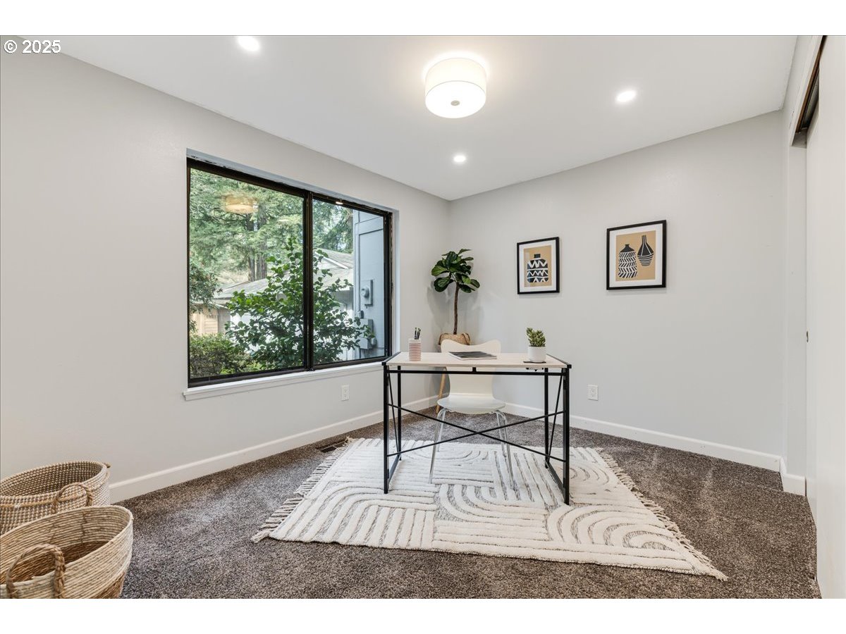 4268 Woodside Circle Lake Oswego, OR 97035 - Photo 16 of 44 a dining room with wooden floor and a window