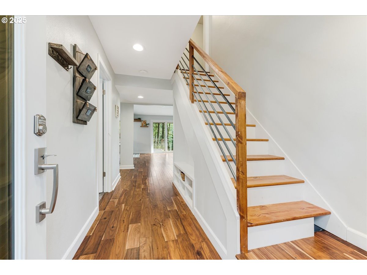4268 Woodside Circle Lake Oswego, OR 97035 - Photo 17 of 44 a view of entryway and hall with wooden floor