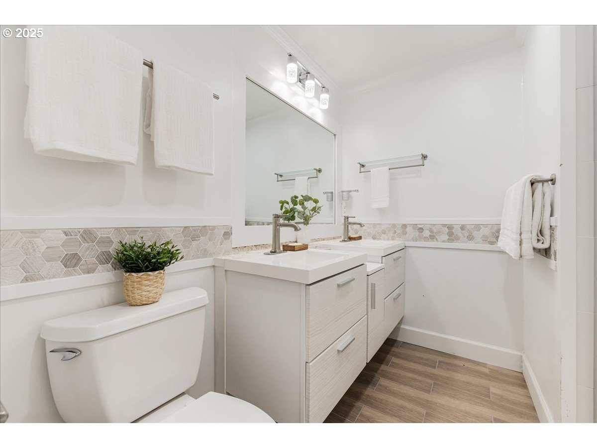 4268 Woodside Circle Lake Oswego, OR 97035 - Photo 21 of 44 a kitchen with a sink dishwasher a stove a white refrigerator and cabinets