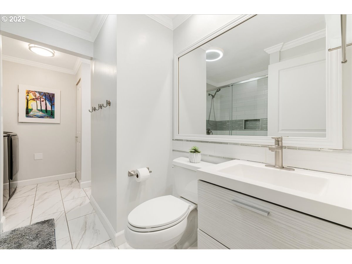 4268 Woodside Circle Lake Oswego, OR 97035 - Photo 25 of 44 a bathroom with a sink and a mirror