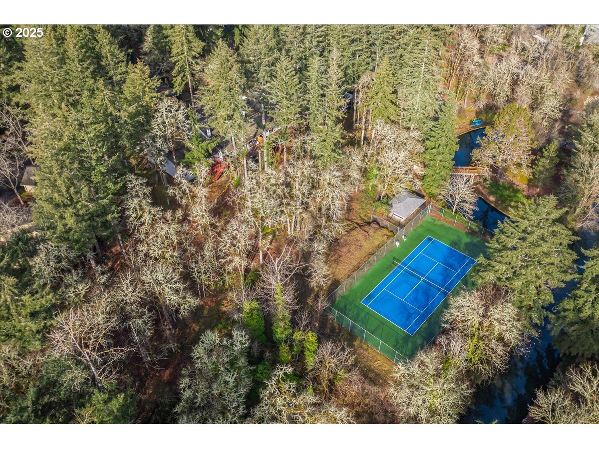 4268 Woodside Circle Lake Oswego, OR 97035 - Photo 30 of 44 a view of a house with a yard and a forest