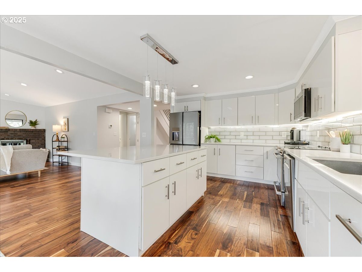 4268 Woodside Circle Lake Oswego, OR 97035 - Photo 9 of 44 a kitchen with white cabinets and white appliances