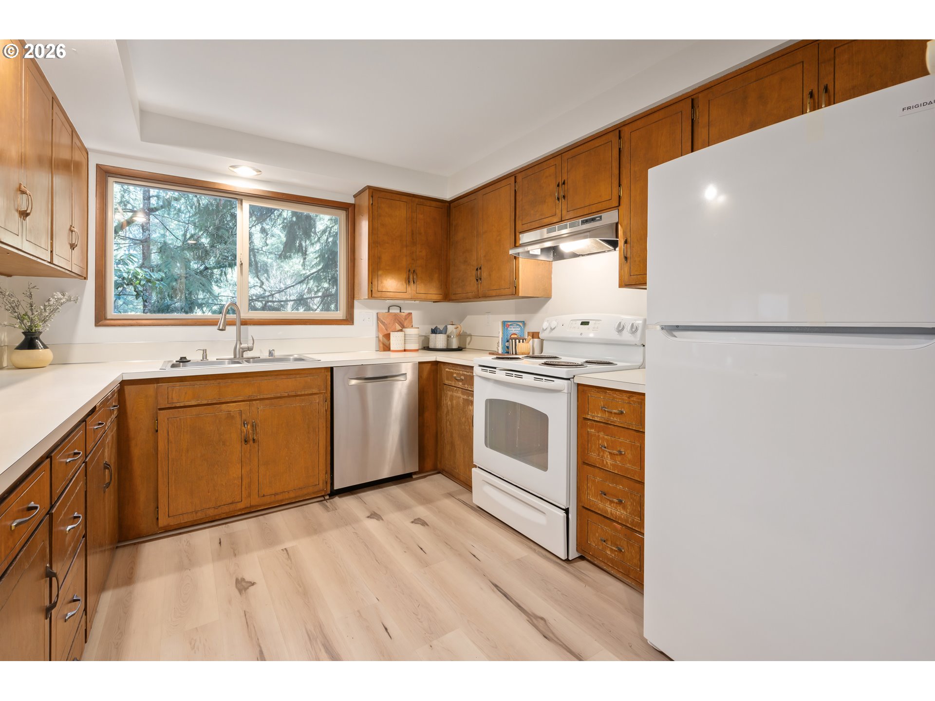 765 Sprague Street Eugene, OR 97405 - Photo 17 of 48 a kitchen with white cabinets and white appliances