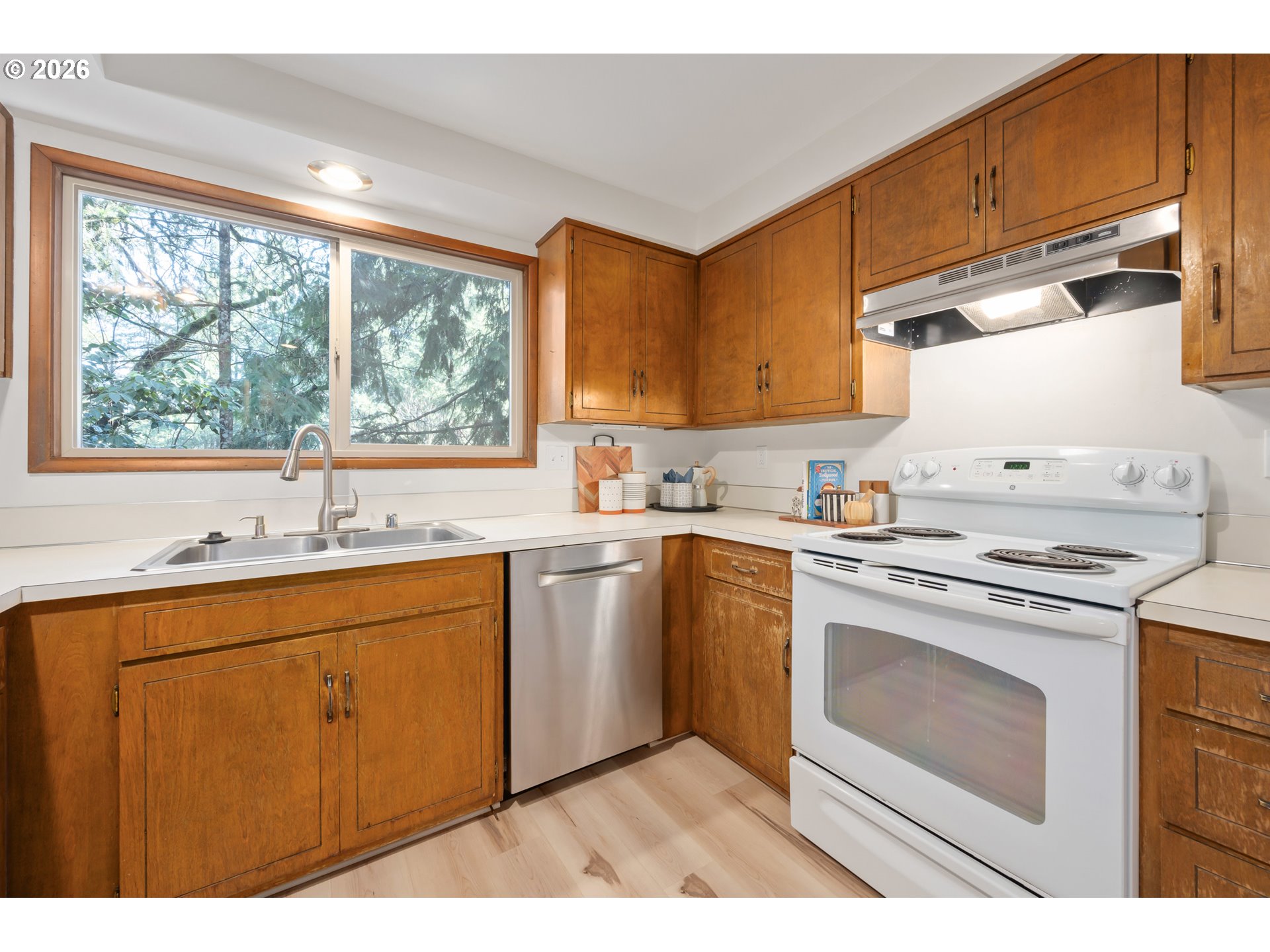 765 Sprague Street Eugene, OR 97405 - Photo 18 of 48 a kitchen with a sink stove and cabinets