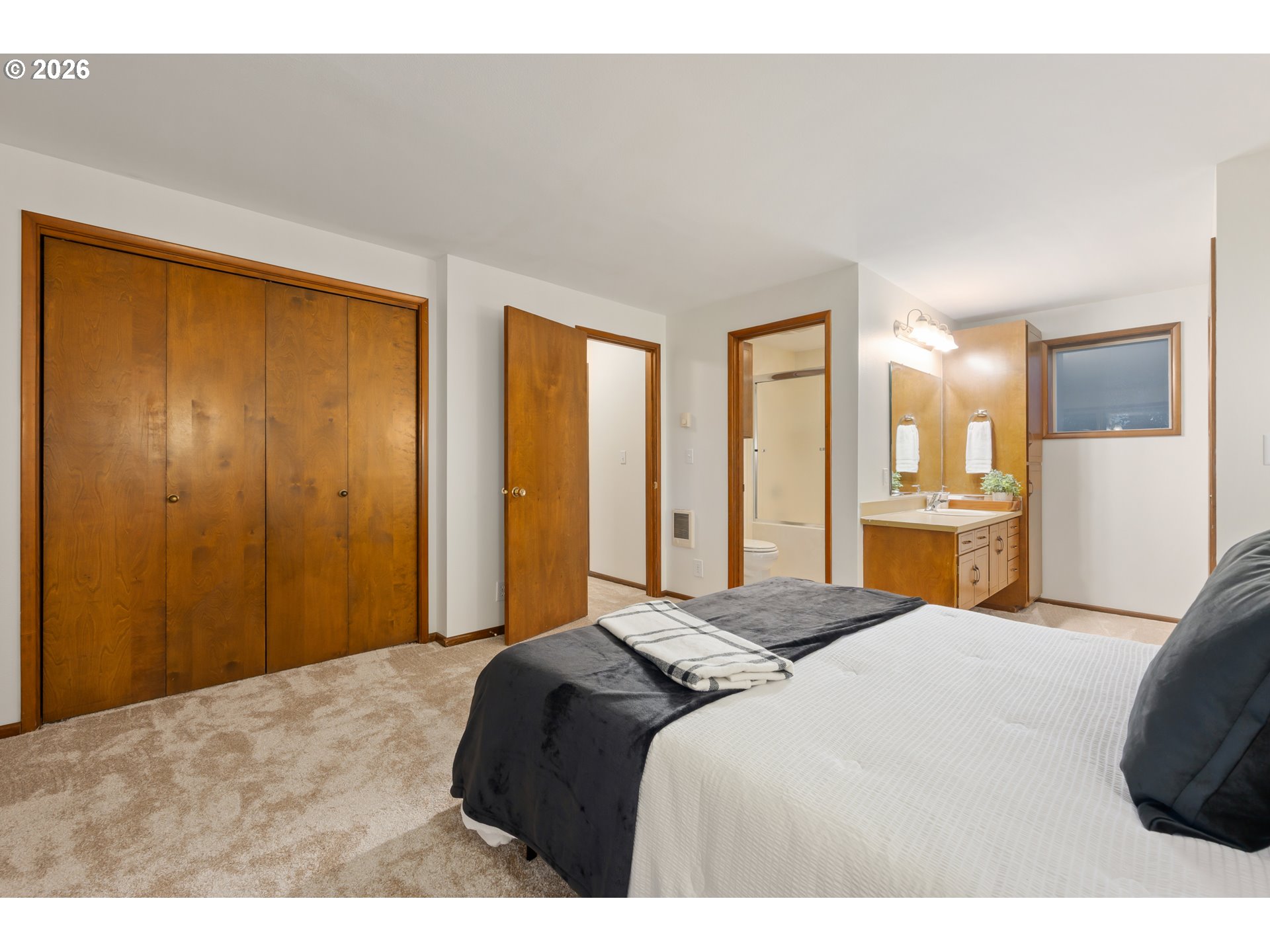 765 Sprague Street Eugene, OR 97405 - Photo 26 of 48 a bedroom with a bed and a large mirror