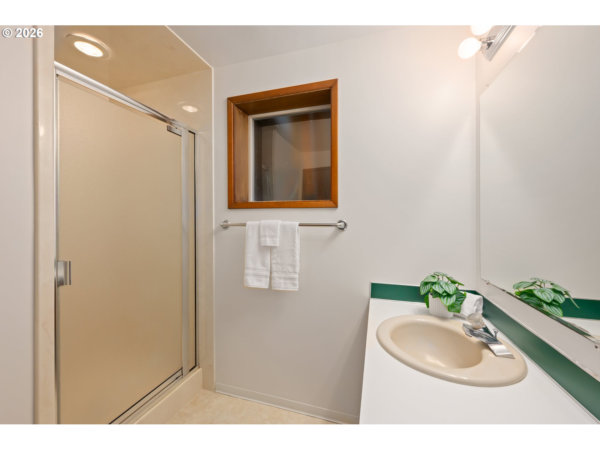 765 Sprague Street Eugene, OR 97405 - Photo 35 of 48 a bathroom with a sink a mirror and a shower