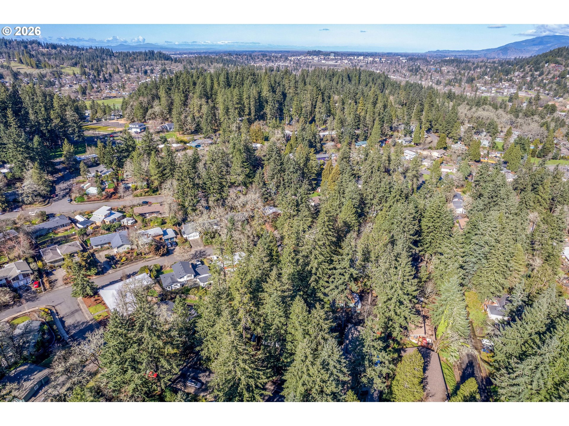 765 Sprague Street Eugene, OR 97405 - Photo 46 of 48 a view of a city with lush green forest