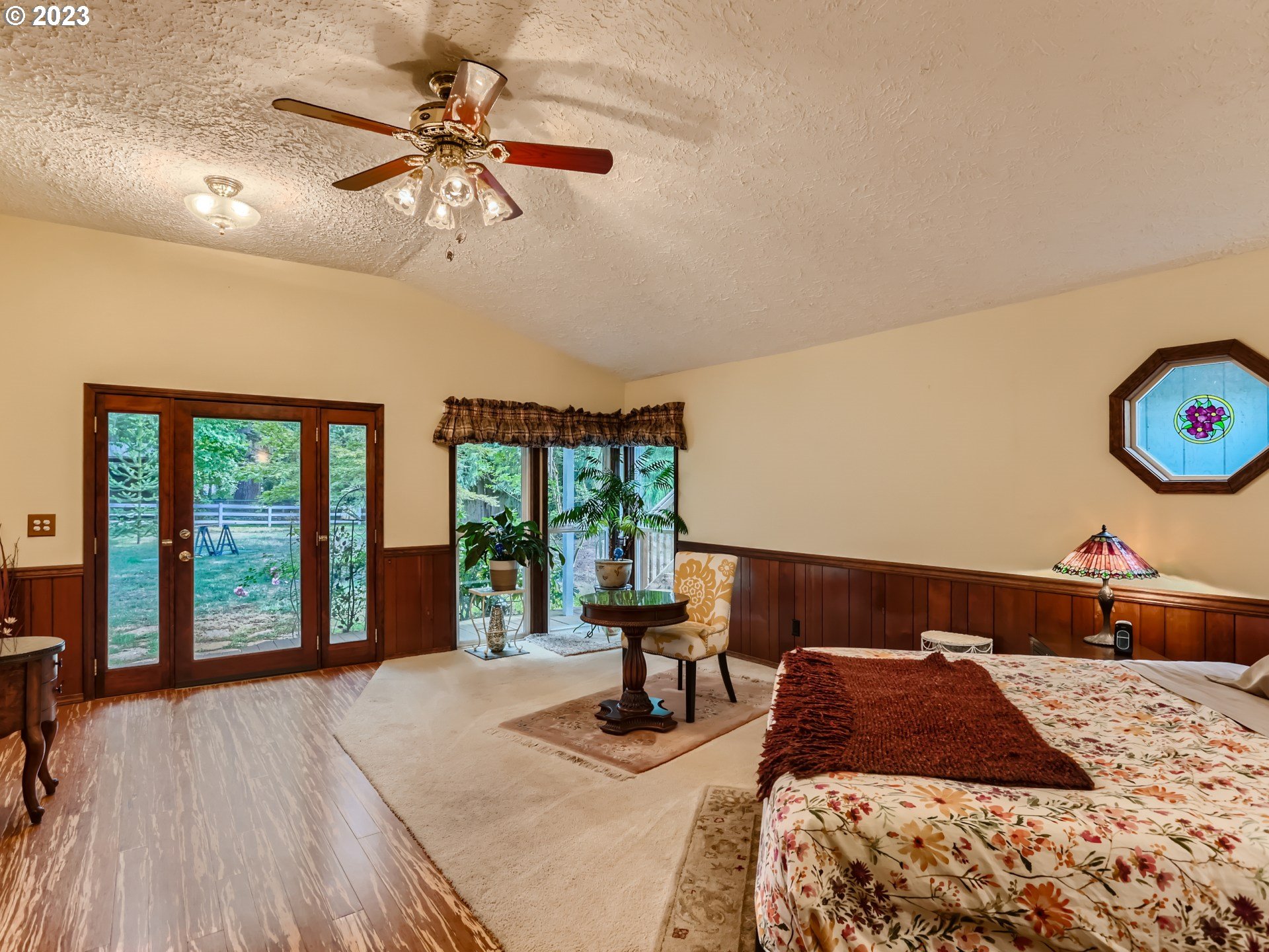 13611 South Union Hall Road Canby, OR 97013 - Photo 17 of 29 a bedroom with a bed and a chandelier
