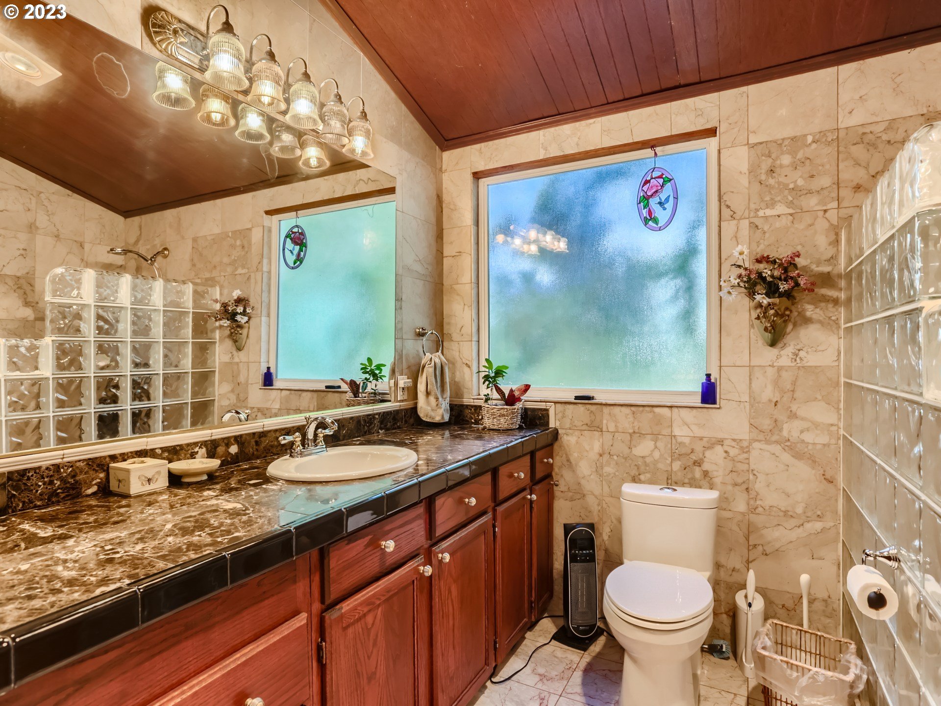 13611 South Union Hall Road Canby, OR 97013 - Photo 20 of 29 a bathroom with a granite countertop sink mirror vanity and toilet
