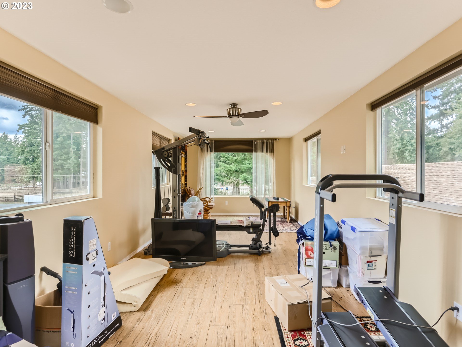 13611 South Union Hall Road Canby, OR 97013 - Photo 24 of 29 a living room with furniture a fireplace and large windows