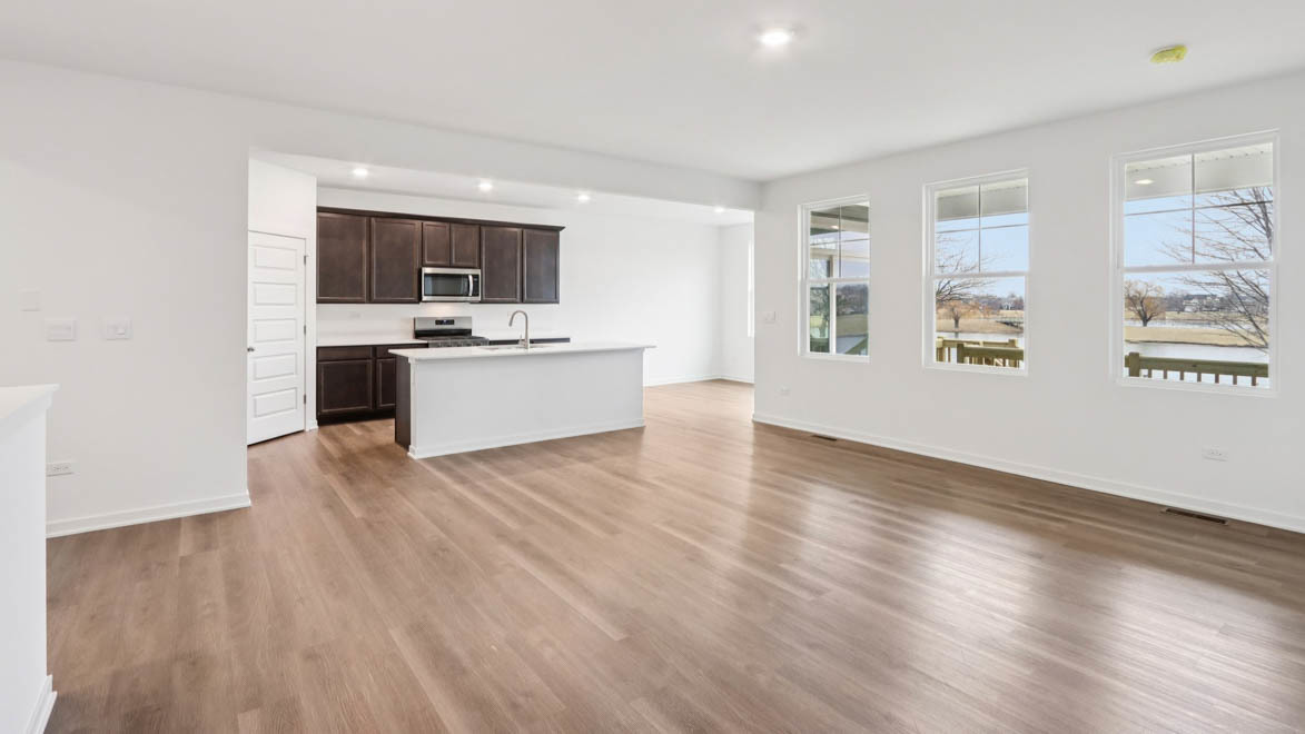 284 Snowdrop Lane Elgin, IL 60124 - Photo 4 of 33 a view of a kitchen with a sink and a stove top oven